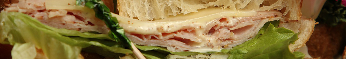 Eating Deli Sandwich at John's Village Market restaurant in Wayne, PA.